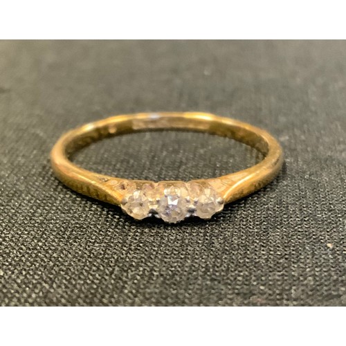 476 - A diamond three stone ring, total estimated diamond weight approx 0.10ct, 18ct gold shank, size P, 2... 