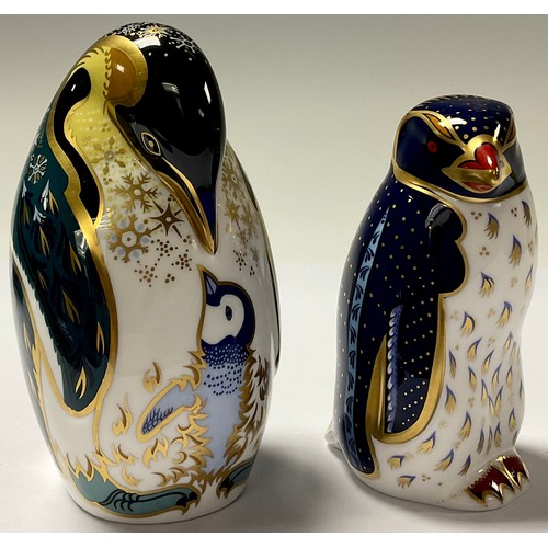 27 - A Royal Crown Derby paperweight, Rockhopper Penguin, gold stopper; another Penguin and Chick, gold s... 