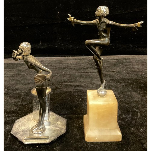 80 - An Art Deco spelter figure, of a flapper girl dancer, c.1935; a figural table lighter, similar (2)