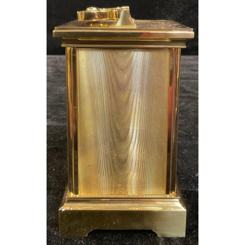 96 - A Taylor & Bligh brass carriage timepiece, quartz movement, 17cm high over swing handle