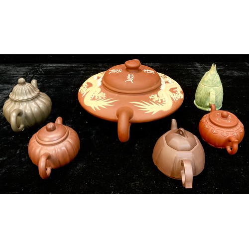 136 - The Tea Ceremony - six Oriental teapots, various forms including red stoneware, one decorated in sti... 