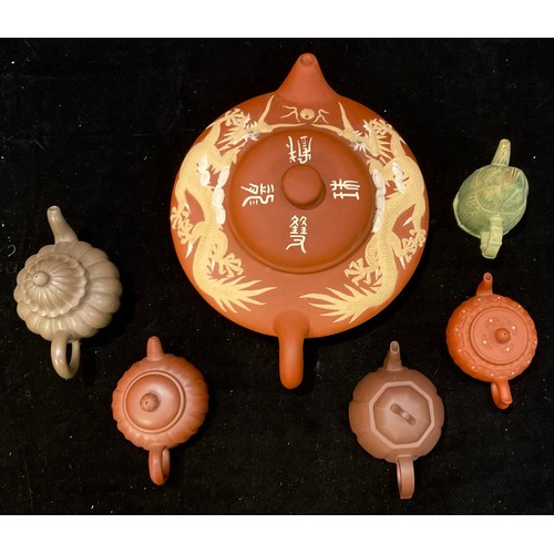 136 - The Tea Ceremony - six Oriental teapots, various forms including red stoneware, one decorated in sti... 