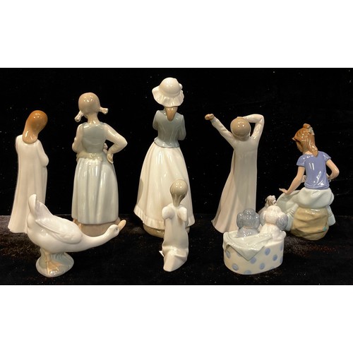 138 - A Spanish porcelain Nao figure girl with kittens, 22.5cm, printed mark; other nao figures, girls wit... 