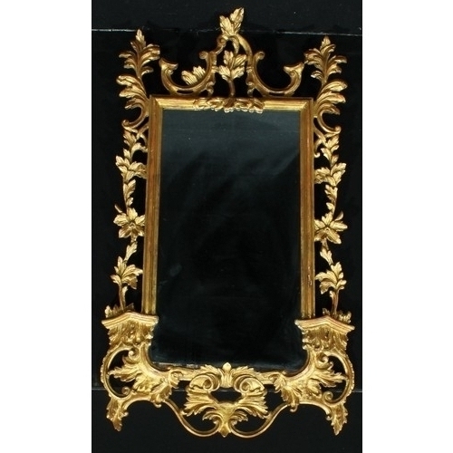 1359 - An 18th century style pier glass, plain mirror plate, the frame in the Rococo taste with leaves and ... 