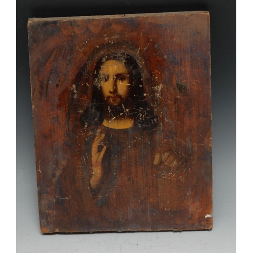 237 - An Eastern Orthodox icon, painted in polychrome with Christ, his handing making the gesture of Chi R... 