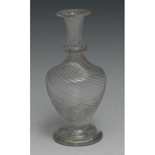 247 - An early 19th century wrythen glass ovoid decanter, pontil scar to base, 17.5cm  high