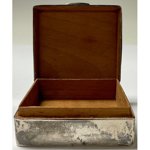 254 - An early 20th century silver rounded rectangular cigarette box, hinged cover, cedar lined, monogramm... 