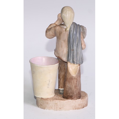 60A - A Sampson Hancock Derby novelty figural spill holder, as a gentleman retiring to bed, 14cm high, blu... 