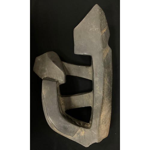 6 - Tribal Art - a carved hardstone abstract figure, polished and textured finish, 65cm high