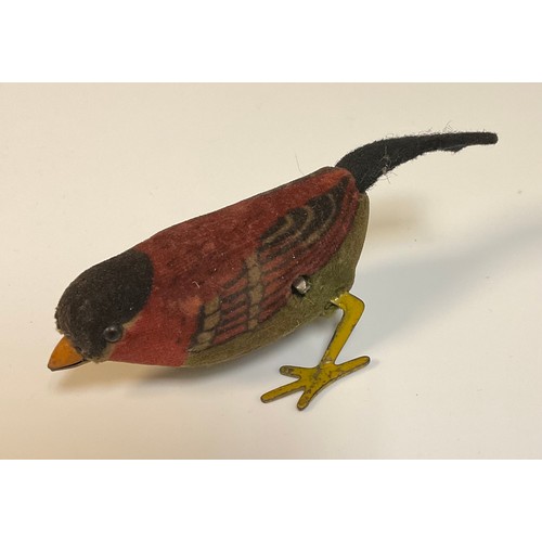 847 - Toys & Juvenalia - a Schuco style novelty felt and velvet clockwork model of a Bird, black pin eyes,... 