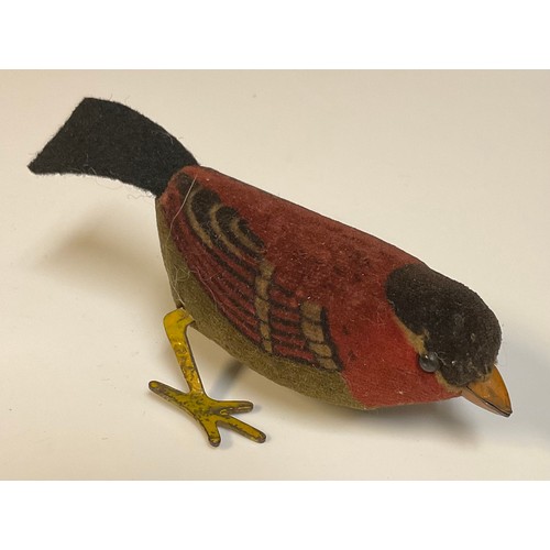 847 - Toys & Juvenalia - a Schuco style novelty felt and velvet clockwork model of a Bird, black pin eyes,... 