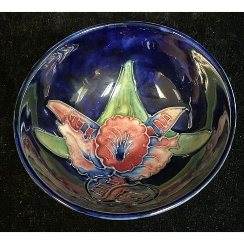 789 - A Moorcroft Iris pattern dish, 11cm diameter, original paper labels, impressed marks