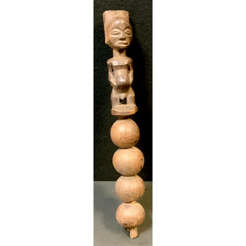 57 - A Luba pipe, carved as a female holding her chest, rotund belly, metal bound bowl, 34.5cm long, Demo... 