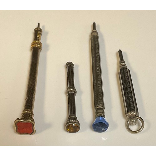 856 - A Victorian propelling pencil, seal top; a silver pencil; others (4)