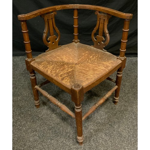 126 - A 19th century lyre back corner chair, rush seat, turned legs & stretchers, 62cm high, 58cm wide, 59... 