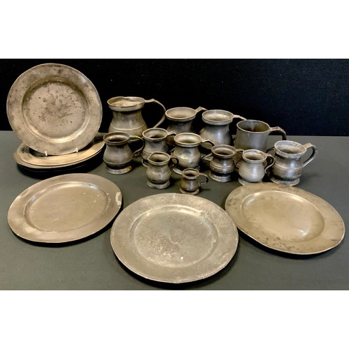 162 - A 17th/18th century pewter plate others, largest 24.5cm diameter;   measures, mugs etc (19)