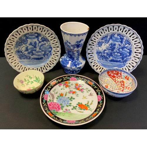 171 - A pair of late 19th/early 20th century Japanese Arita blue and white ribbon plates, floral centres, ... 