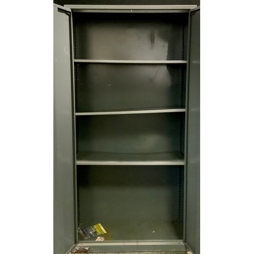 321 - An industrial metal two door cabinet, three shelf interior, 180cm high, 90cm wide, 45cm deep