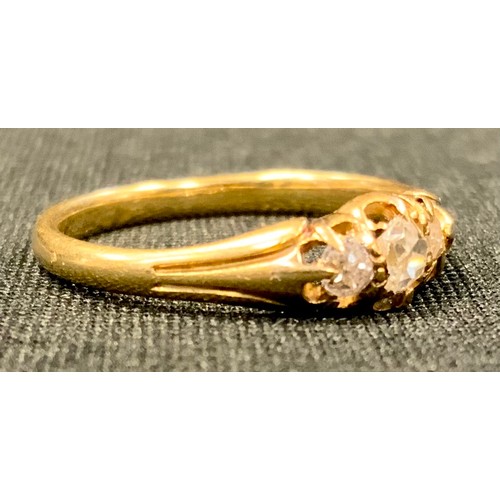 458 - A Victorian three stone diamond ring, old mine cut, 18ct gold shank, 2.2g