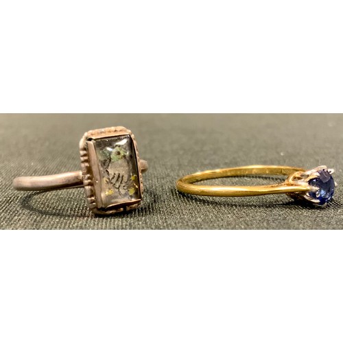 461 - A dress ring, set with a sapphire, plat mounted, 18ct gold shank, 2g; a sterling silver ring, set wi... 