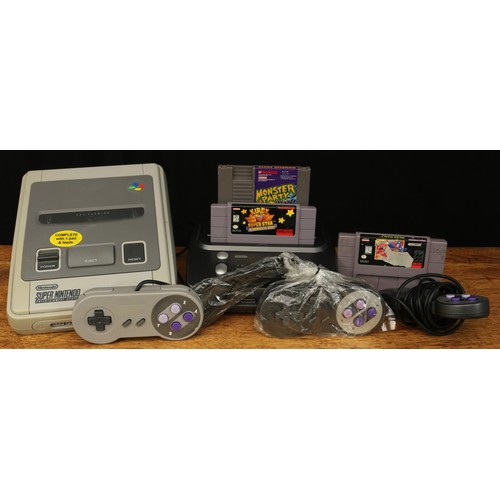 2466A - Vintage Gaming and Technology - a Nintendo Super Nintendo entertainment system, model no.SNSP-001A(U... 