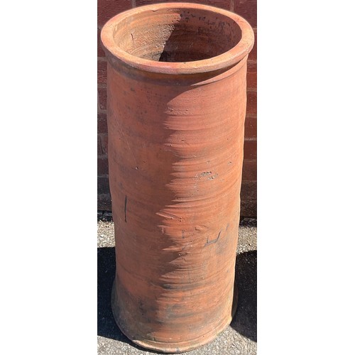 930 - A terracotta chimney pot; another smaller (2)