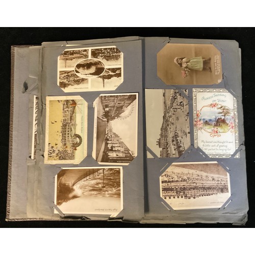 1026 - An Edwardian postcard album, containing early 20th century and later postcards, including topographi... 