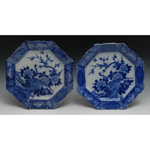 970 - A near pair of Japanese blue and white octagonal plates, transfer printed with birds amongst blossom... 