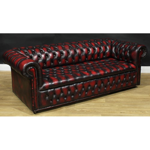 2 - A contemporary Chesterfield sofa, stuffed-over deep-button upholstery, 67cm high, 195cm wide, the se... 