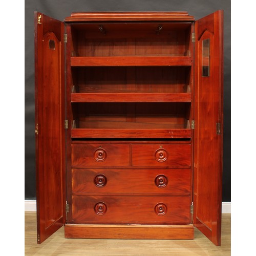 10 - A 19th century mahogany press cupboard, moulded cornice above a pair of panel doors enclosing three ... 