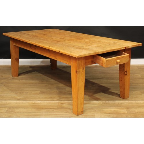 12 - A large pine farmhouse kitchen table, 78cm high, 216.5cm long, 109cm wide