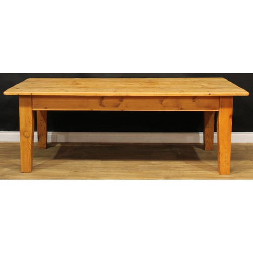 12 - A large pine farmhouse kitchen table, 78cm high, 216.5cm long, 109cm wide