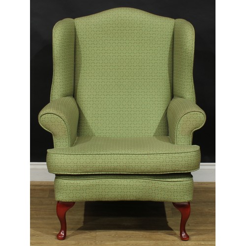 17 - A pair of contemporary George II style wingback armchairs, by Shackletons, 110.5cm high, 83cm wide, ... 