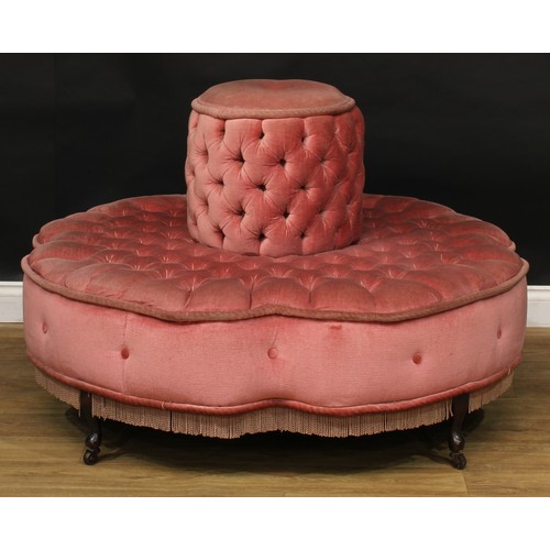 19 - A Victorian style conversation seat, stuffed-over deep-button upholstery, cabriole legs, casters, 80... 