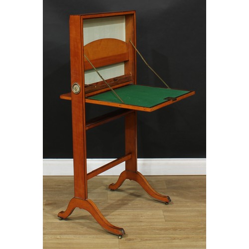 102 - An unusual 19th century satinwood folding desk, the fall front applied with a linen map of Italy, en... 