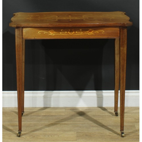 103 - An Art Nouveau mahogany and marquetry centre table, canted serpentine top inlaid with stylised flowe... 