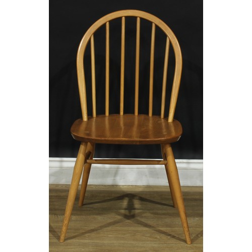 104 - A set of three Ercol beech and elm 2056 Windsor dining chairs, 83cm high, 42.5cm wide, the seat 34cm... 