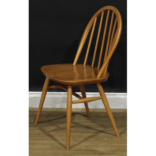 104 - A set of three Ercol beech and elm 2056 Windsor dining chairs, 83cm high, 42.5cm wide, the seat 34cm... 