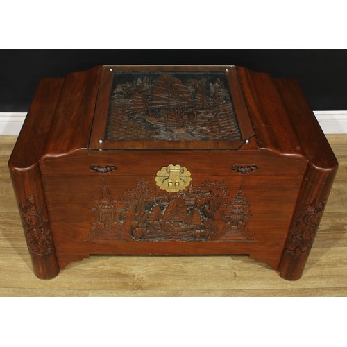 209 - A South-East Asian camphor blanket chest, hinged top carved and applied with a sailing junk and encl... 