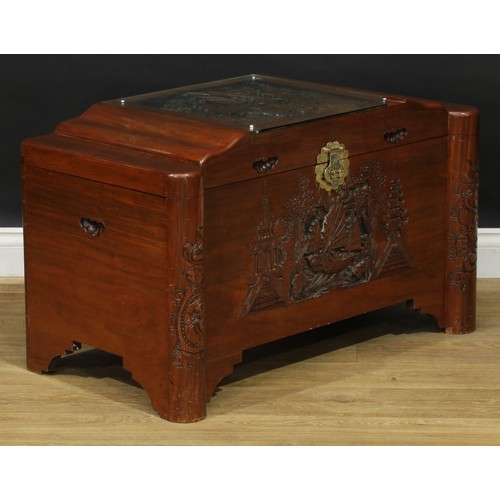 209 - A South-East Asian camphor blanket chest, hinged top carved and applied with a sailing junk and encl... 