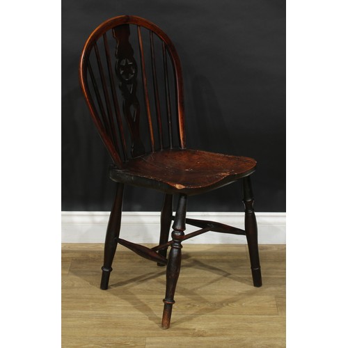 210 - A 19th century yew and elm star-back Windsor side chair, hoop back, shaped and pierced splat, saddle... 