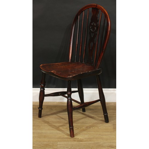 210 - A 19th century yew and elm star-back Windsor side chair, hoop back, shaped and pierced splat, saddle... 