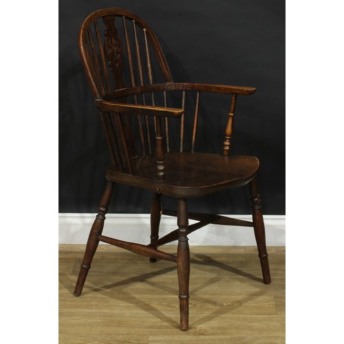 219 - A harlequin set of twelve wheelback Windsor dining chairs, comprising six side chairs and six carver... 