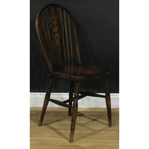 219 - A harlequin set of twelve wheelback Windsor dining chairs, comprising six side chairs and six carver... 