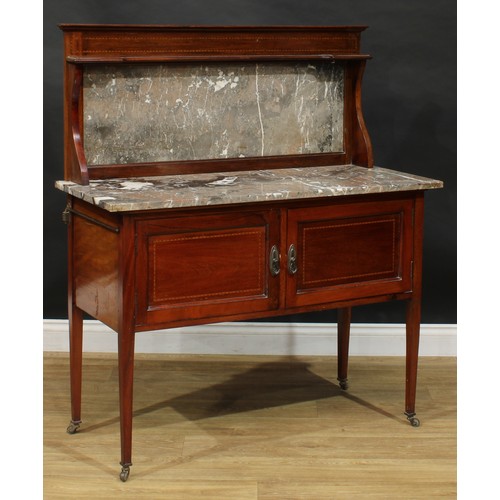 317 - An Edwardian mahogany washstand, marble top with half-gallery above a pair of panel doors, tapered l... 