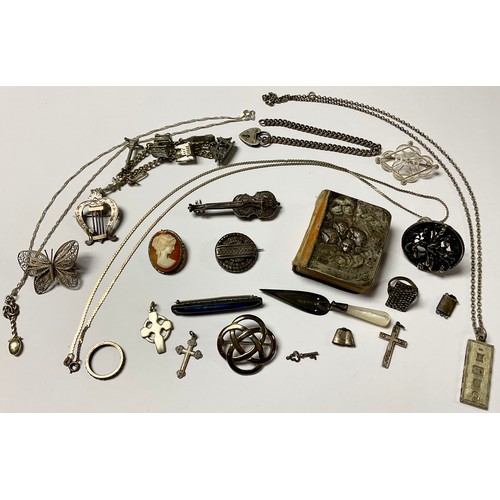 1157 - A silver filigree lyre brooch, others, violin, butterfly, Maltese cross; a silver and mother-of-pear... 