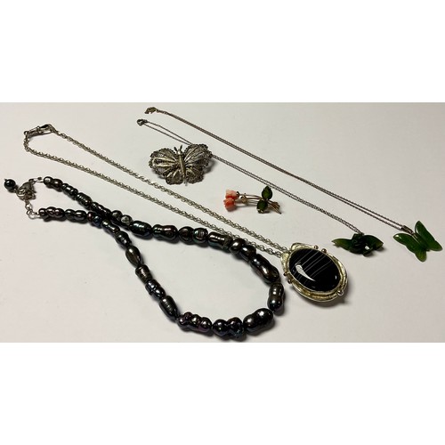 1161 - A silver Art Nouveau style necklace, set with a polished black lace agate cabochon, accented with 9c... 