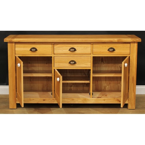 413 - A contemporary oak sideboard, 84cm high, 157cm wide, 45cm deep