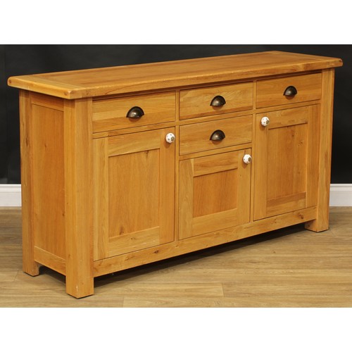 413 - A contemporary oak sideboard, 84cm high, 157cm wide, 45cm deep