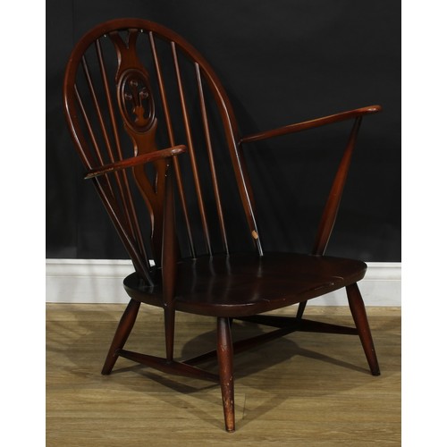 415 - An Ercol Fleur De Lys low armchair, Old Colonial range, 81.5cm high, 70cm wide, the seat 46cm wide a... 